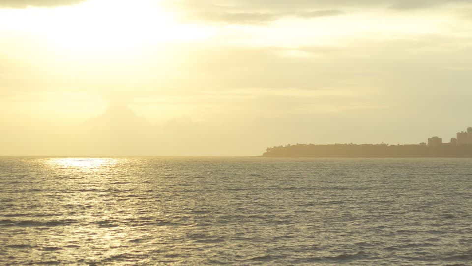 Marine Drive which includes general coastal views and a sunset