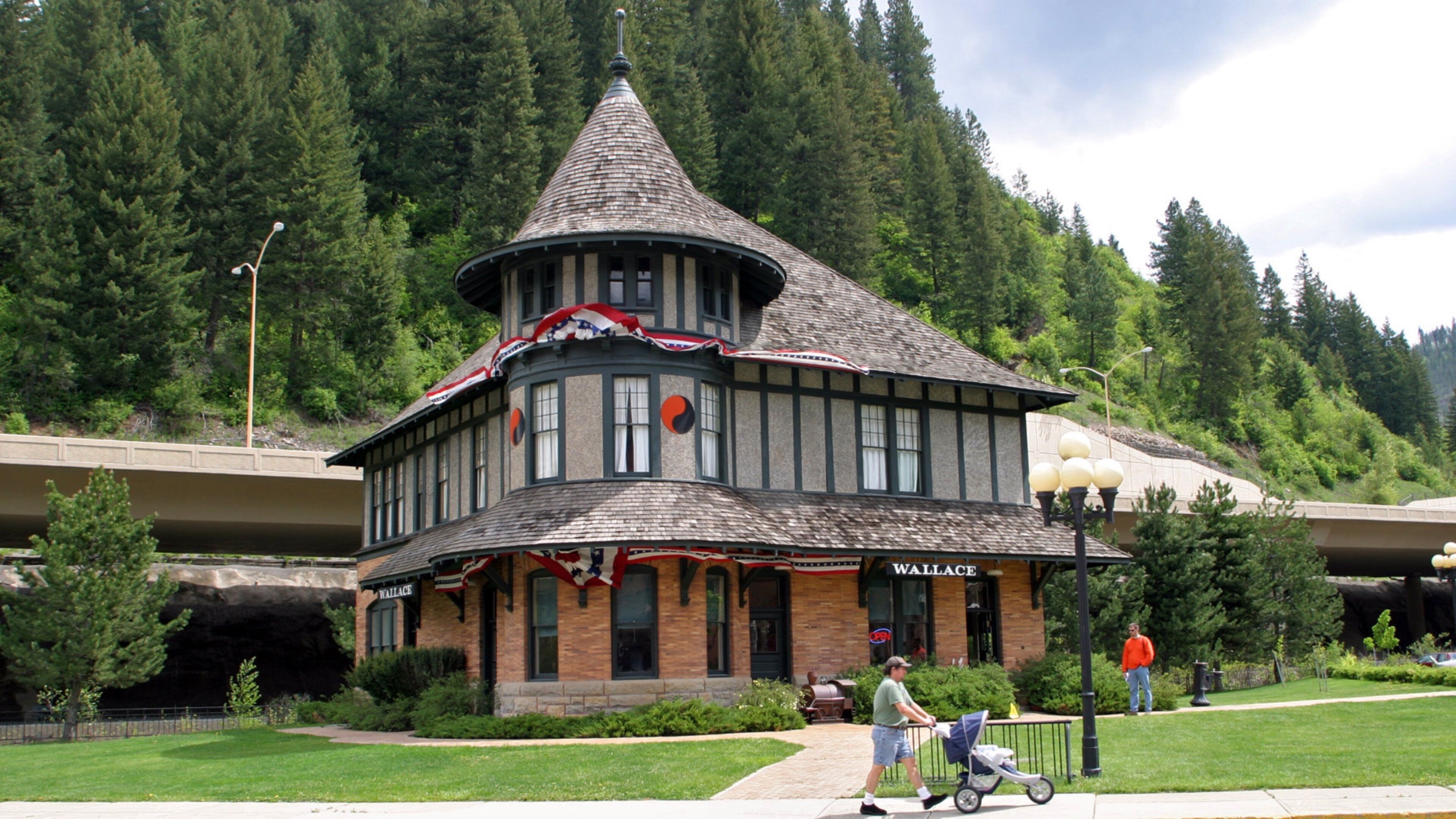 A historic building with a distinctive turret and a sign reading "WALLACE".