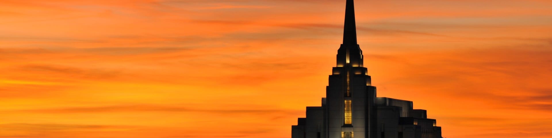 Rexburg featuring a church or cathedral and a sunset