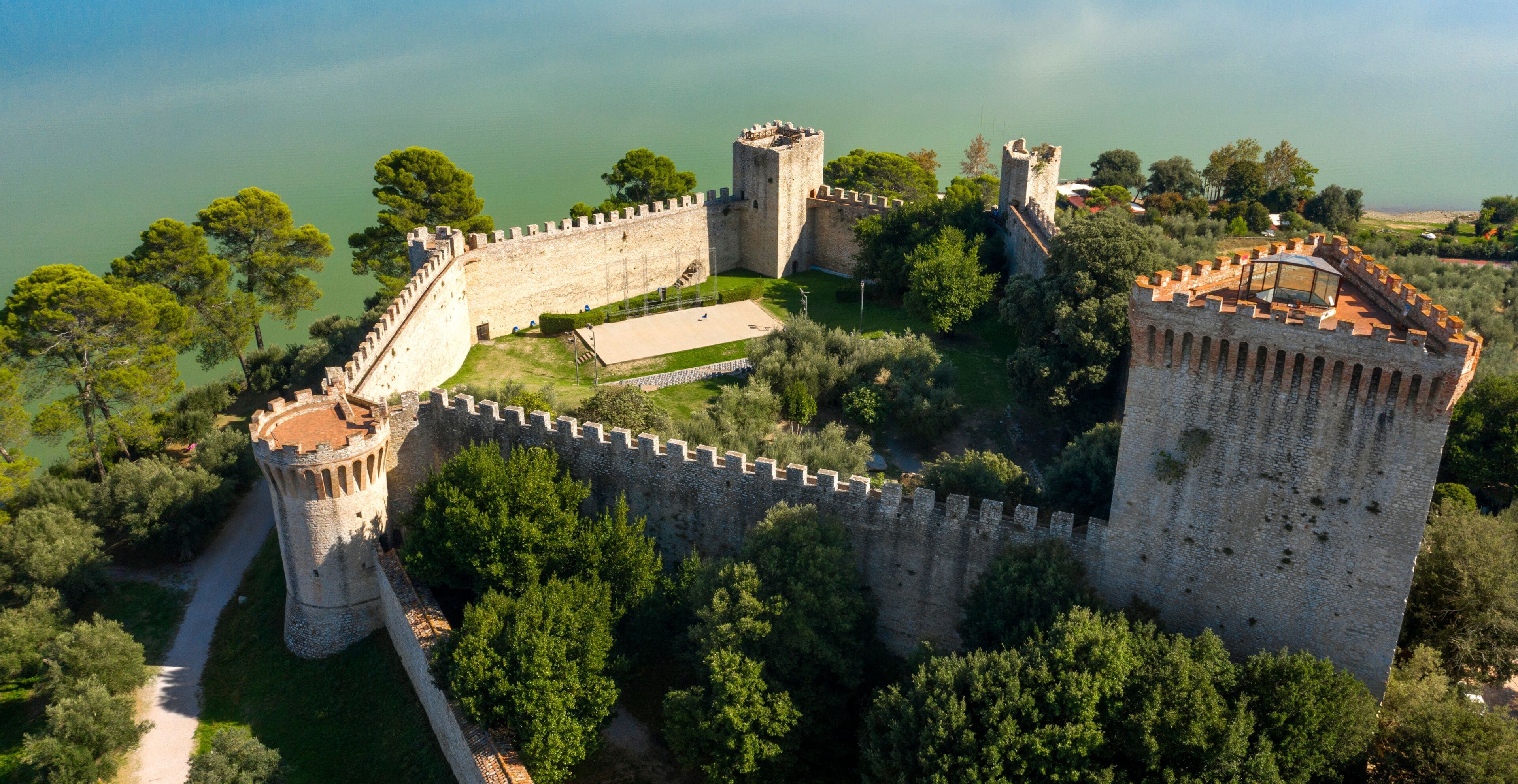 Aerial view on Fortress of the Lion in historical center of Castiglione del Lago, in Umbria, Italy. The castle is now used for events and is located on Lake Trasimeno in the province of Perugia.