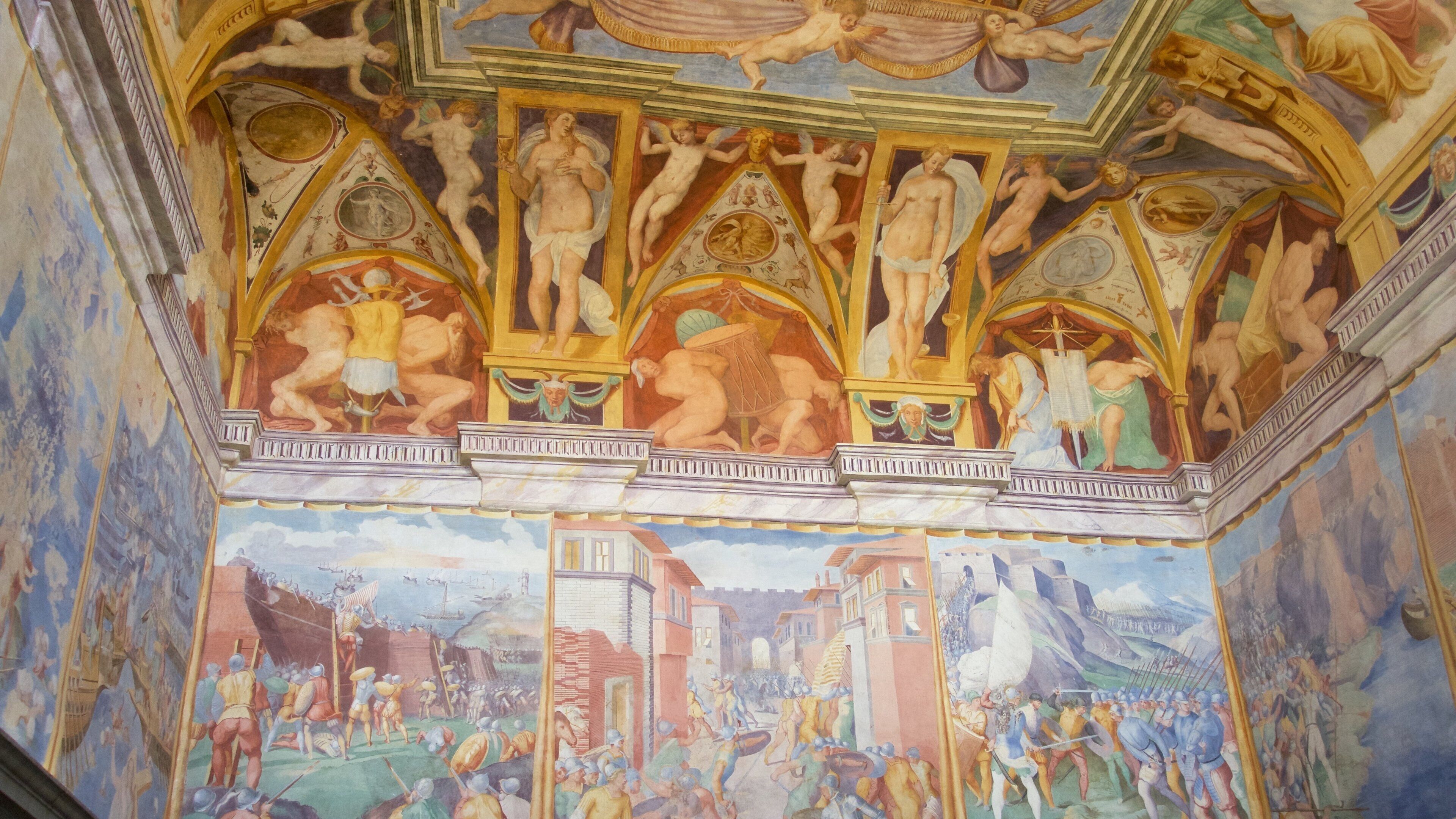 Castiglione del Lago which includes a castle, interior views and art