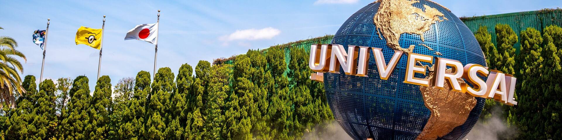 Universal Studios Japanâą featuring rides and signage as well as a large group of people