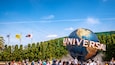 Universal Studios Japan™ featuring rides and signage as well as a large group of people