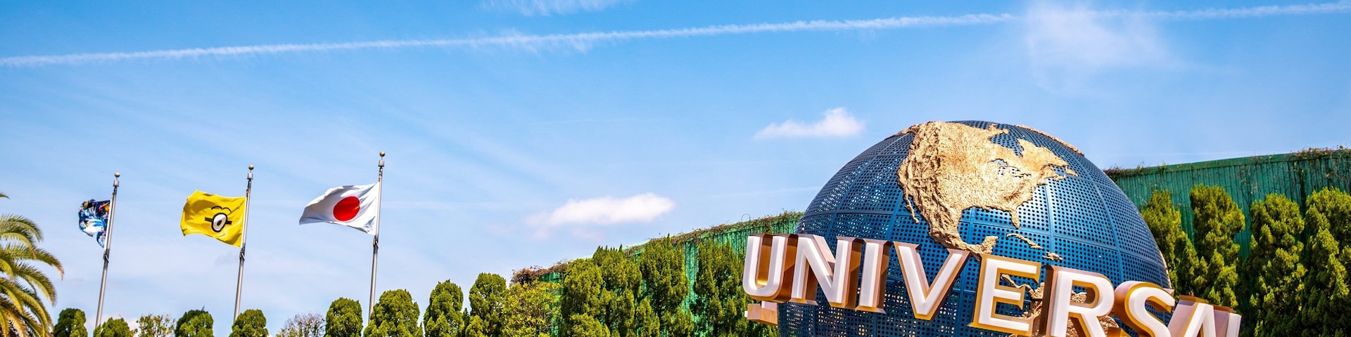 Universal Studios Japan™ featuring rides and signage as well as a large group of people