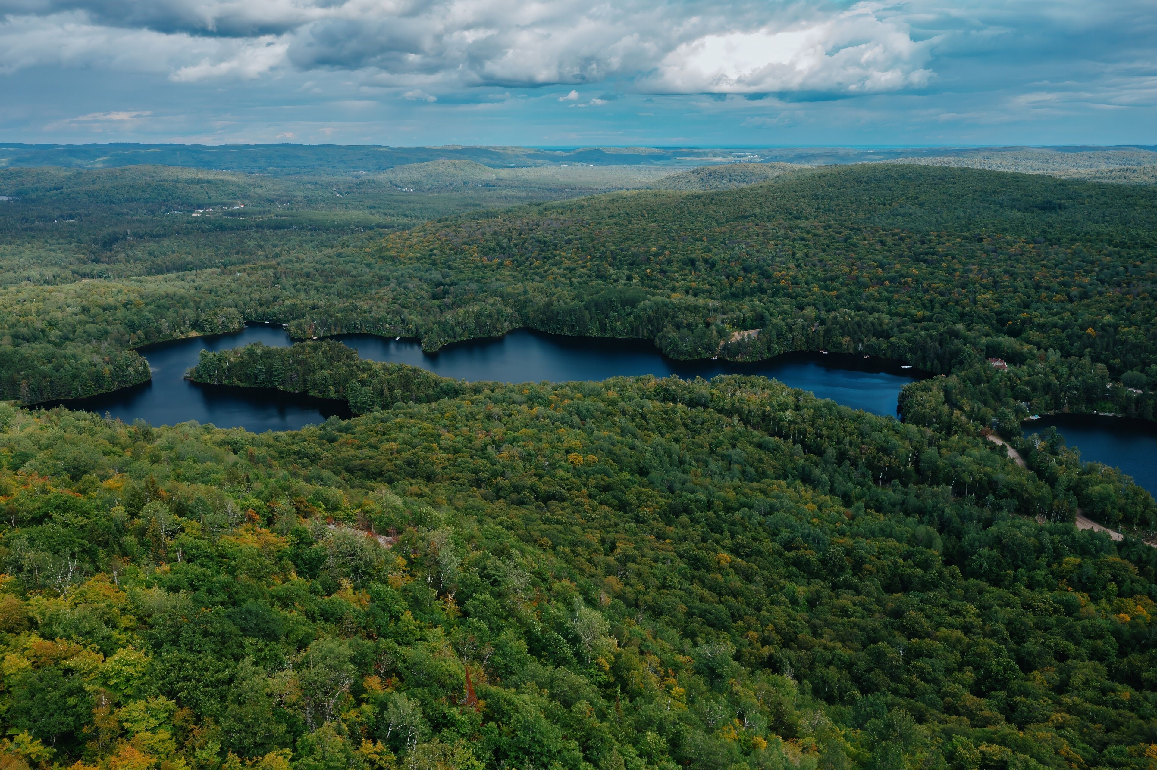 Lake and forest in nature. Lac Lambert, Saint-Alexis-des-Monts, Quebec, Canada.