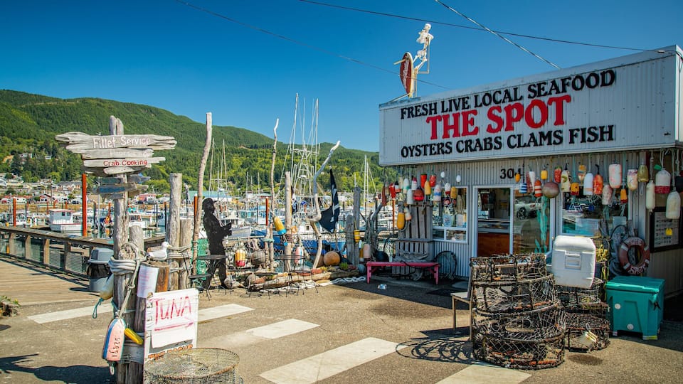 A seafood shop named 'The Spot' with a signboard advertising oysters, crabs, and clams.