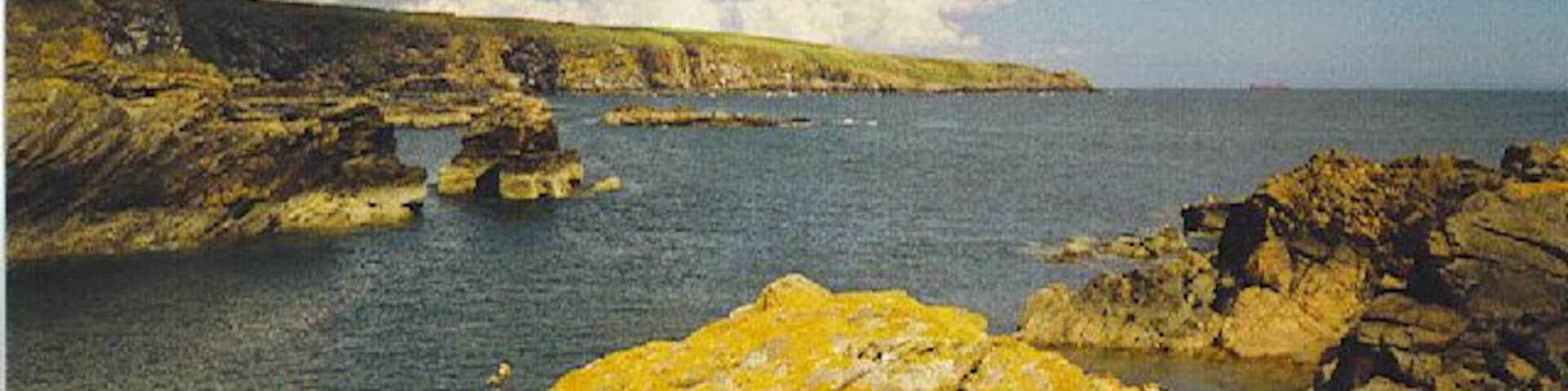 Looking North from Cove Bay Harbour. A rocky coastline with few natural harbours.