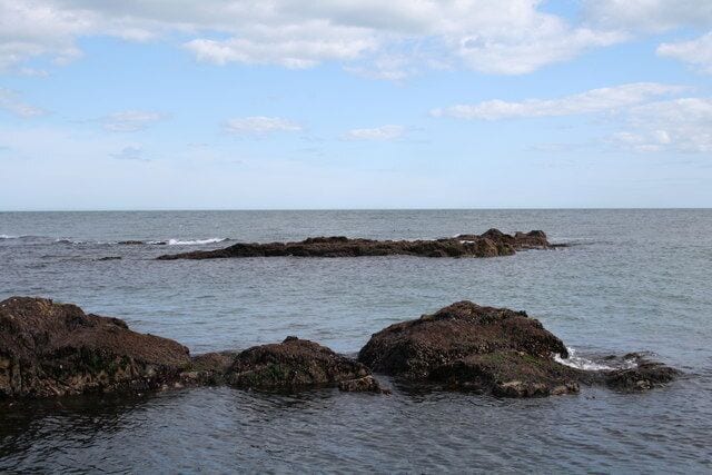 Rocks South of Greg Ness. Visible at low tide, these seaweed and barnacle rocks are appreciated by the sea birds until human geographers come a stumblin' across the rocks.