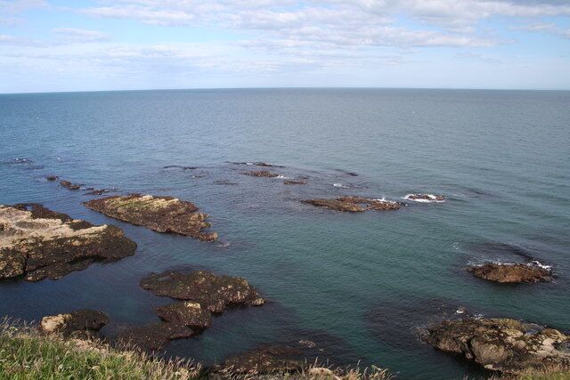 Rocks near Greg Ness. View taken from the coastal path at low tide.