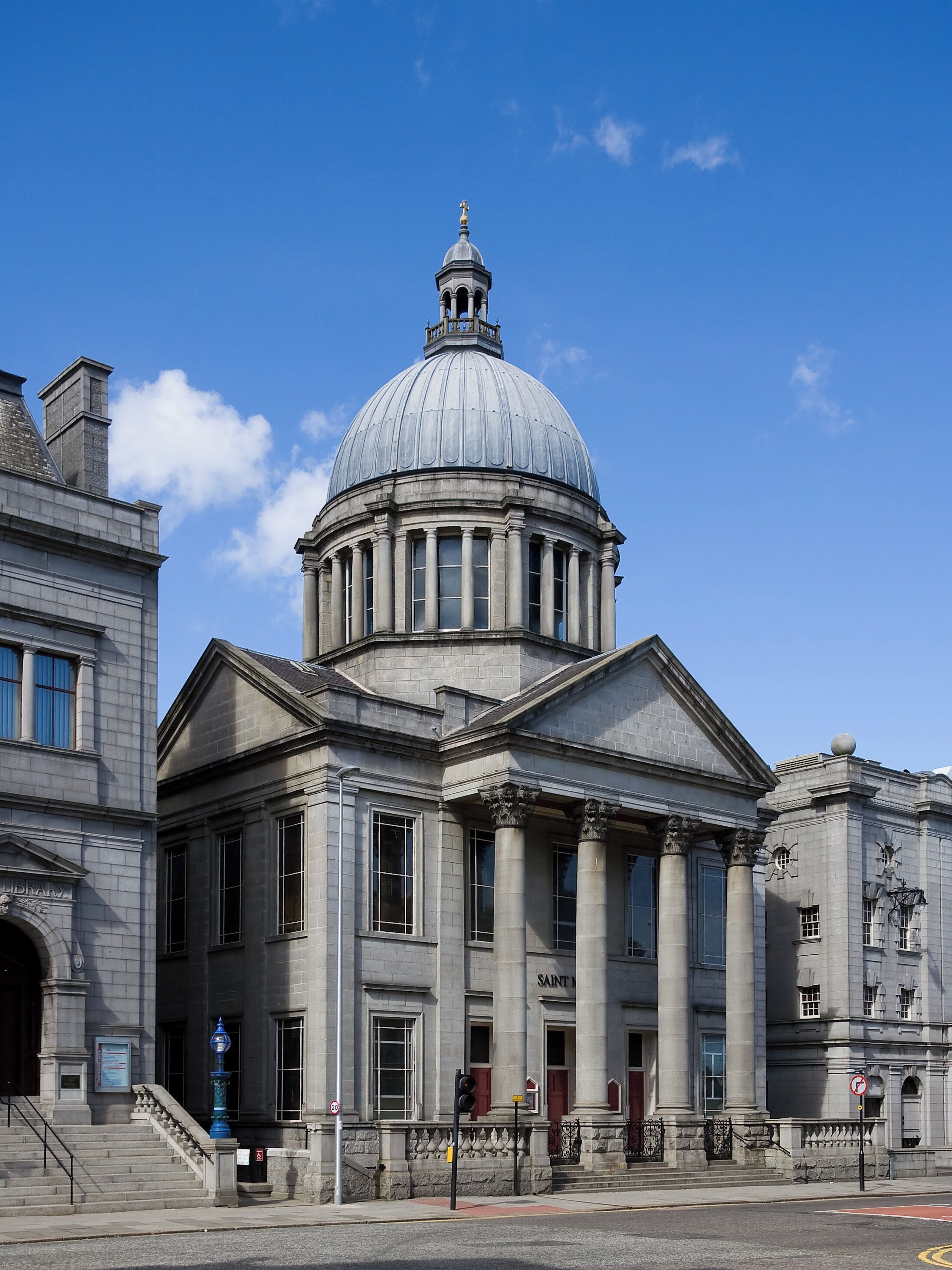 A large neoclassical building with a prominent dome and columns.