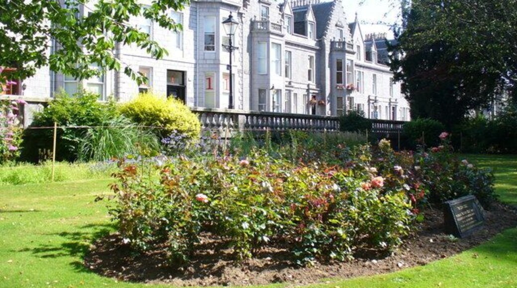 Rubislaw Terrace Gardens Manicured lawns with memorial rose bed facing the main thoroughfare of Albyn Place. The granite terrace of former houses now mainly holds offices.