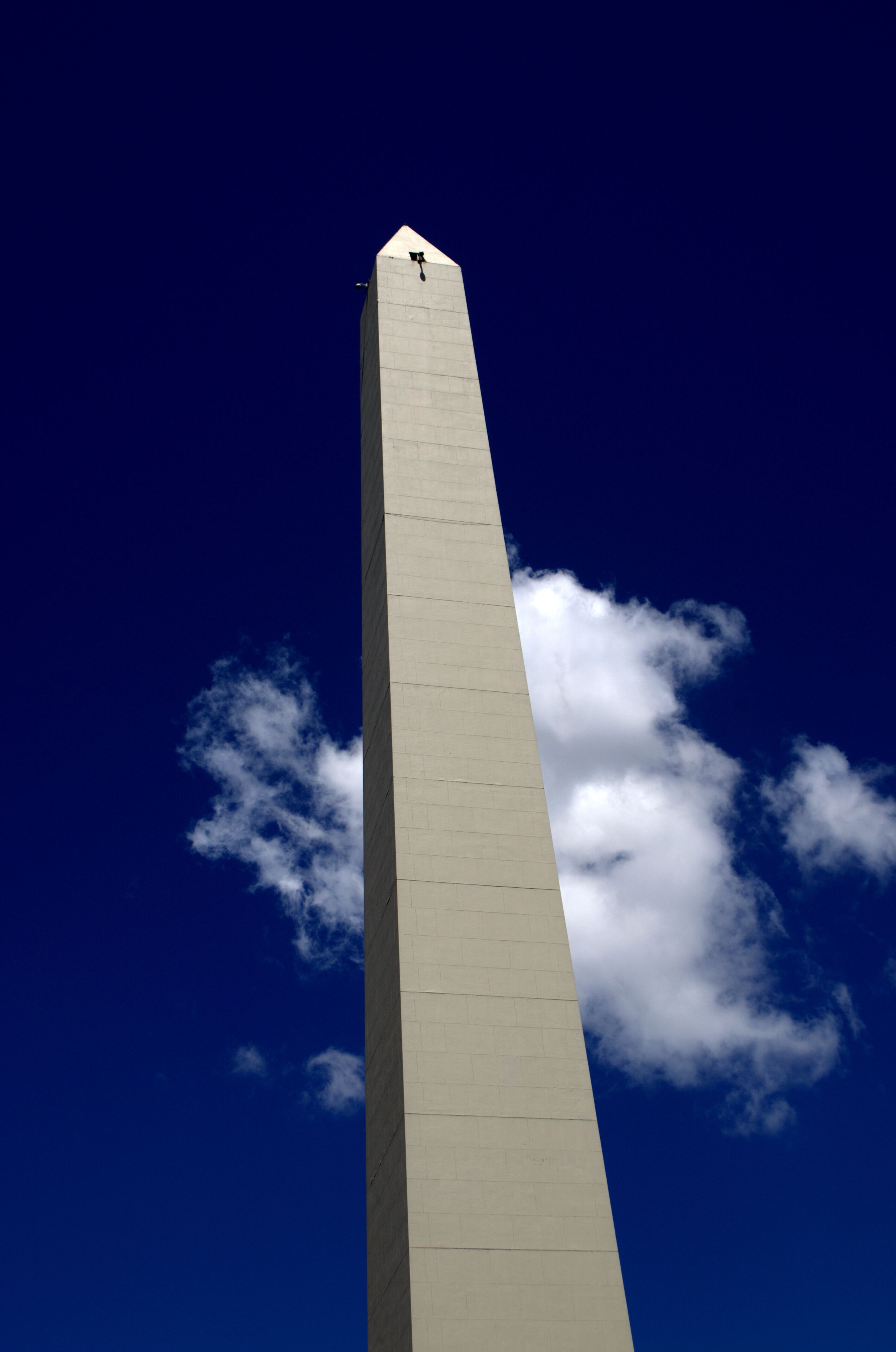 he Obelisk or El Obelisco, Buenos Aires `s most famous monument against blue sky
