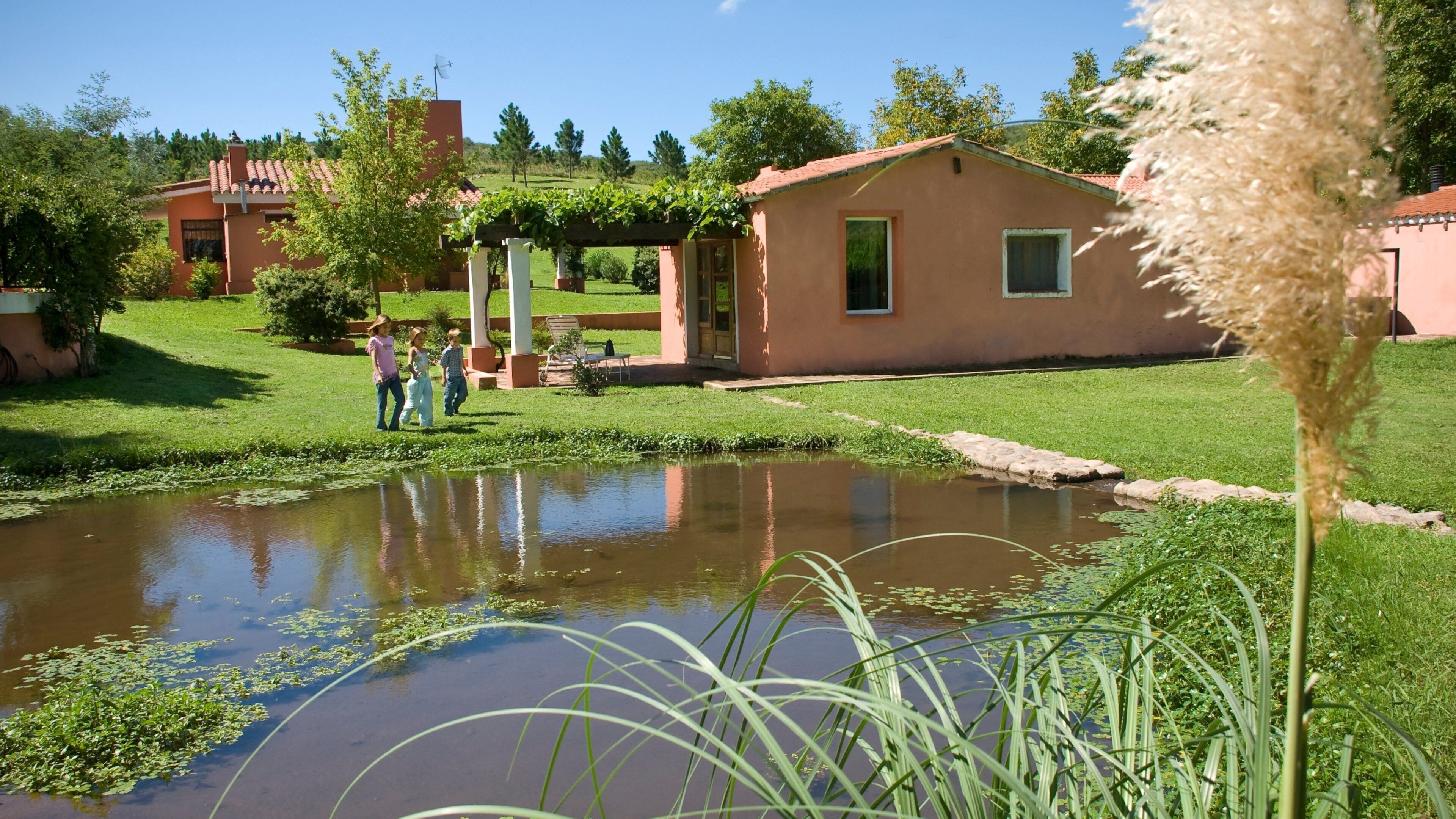 Cordoba which includes a house, a pond and a garden
