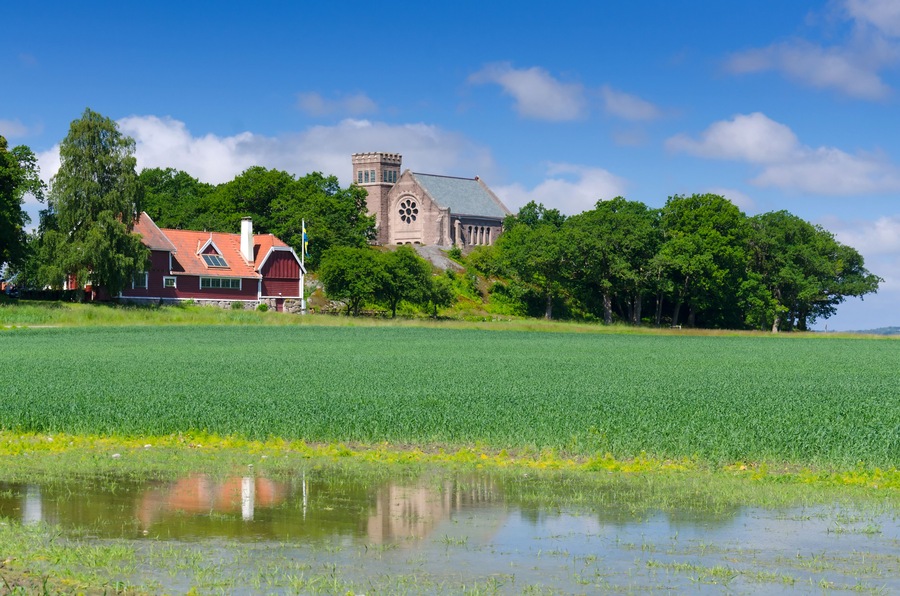 Old Swedish cathedral with water reflection