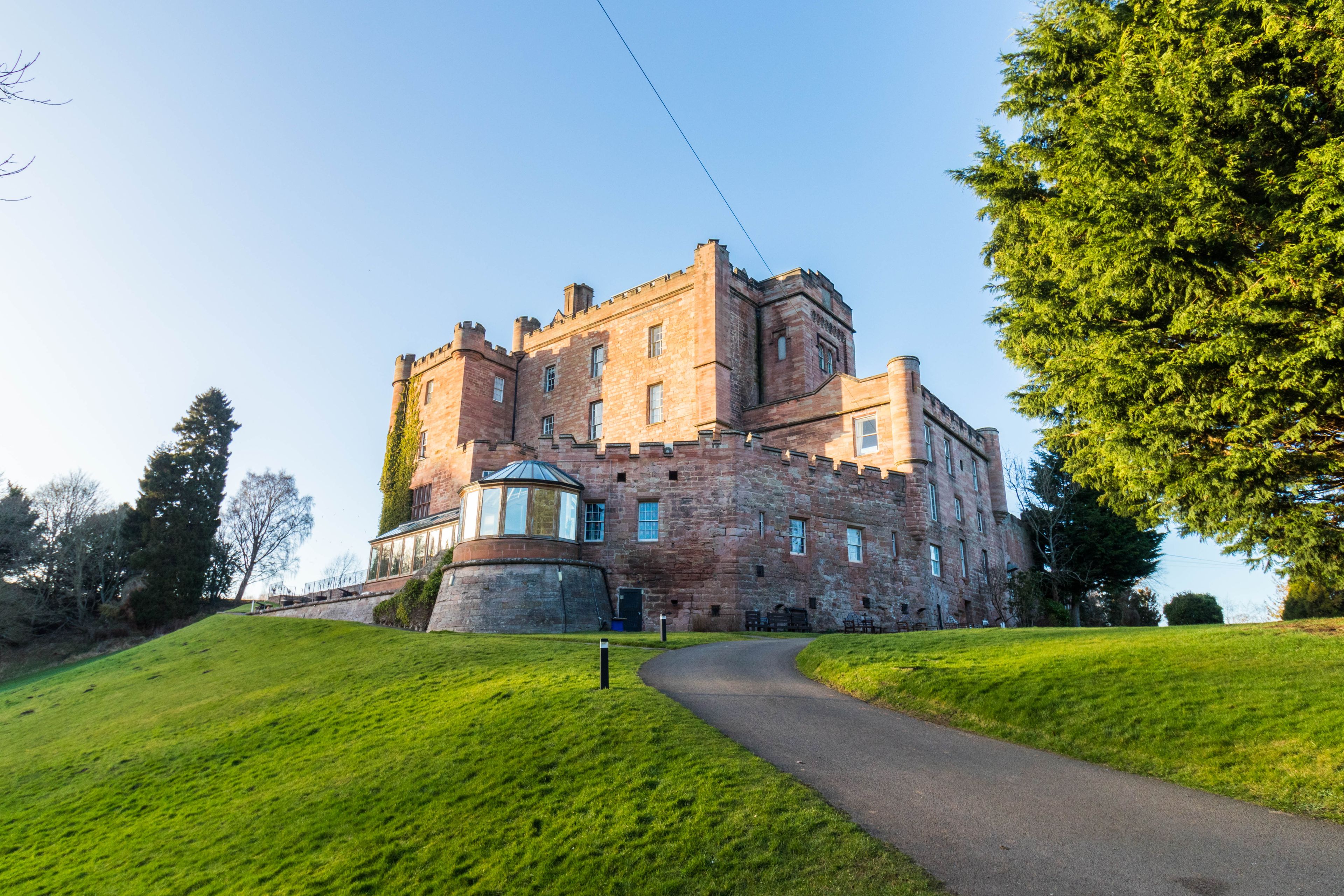 Dalhousie castle hotel in Bonnyrigg, Midlothian, Scotland. Photo of the castle from the back with restaurant anex.