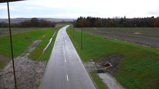 New road at Hawthornden Only when I got home did I think I should have nipped down the embankment and enjoyed the feeling of cycling on this soon to be open road without the constant worry of cars!