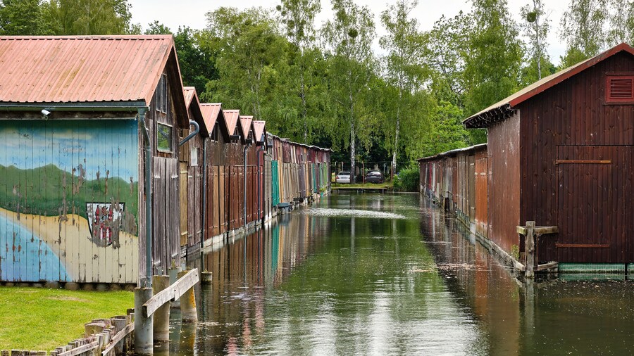 Colorful old boathouses along the waterfront at Tollense See Neubrandenburg