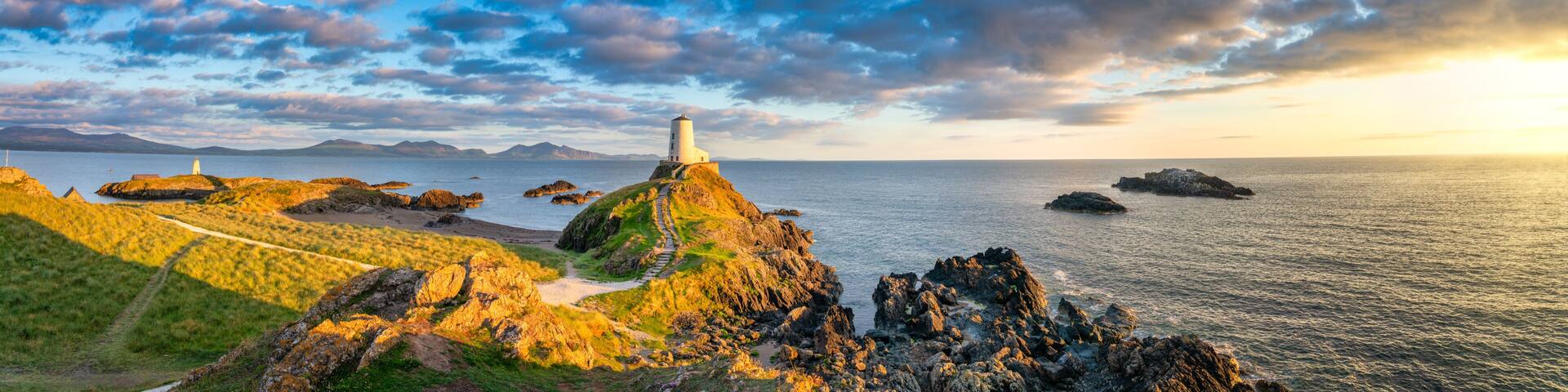 Sceninc sunset view of Lighthouse on Llanddwyn Island at the coast of Anglesey in North Wales,UK