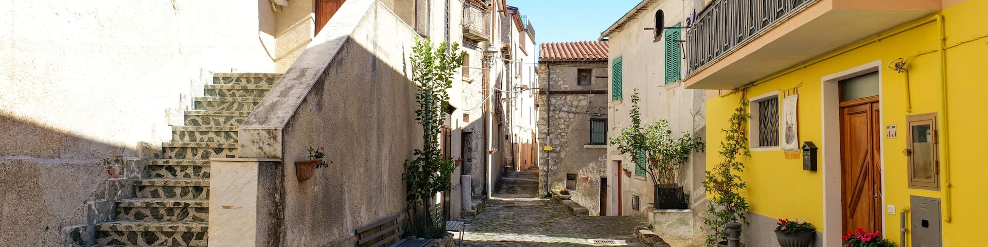 A narrow street among the old houses of Atena Lucana, a village in the province of Salerno, Italy.