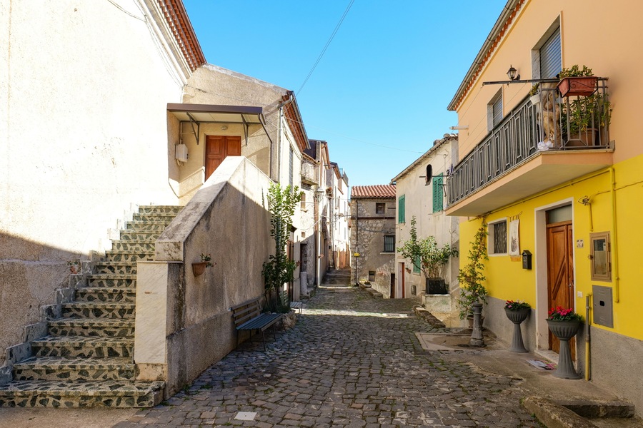 A narrow street among the old houses of Atena Lucana, a village in the province of Salerno, Italy.