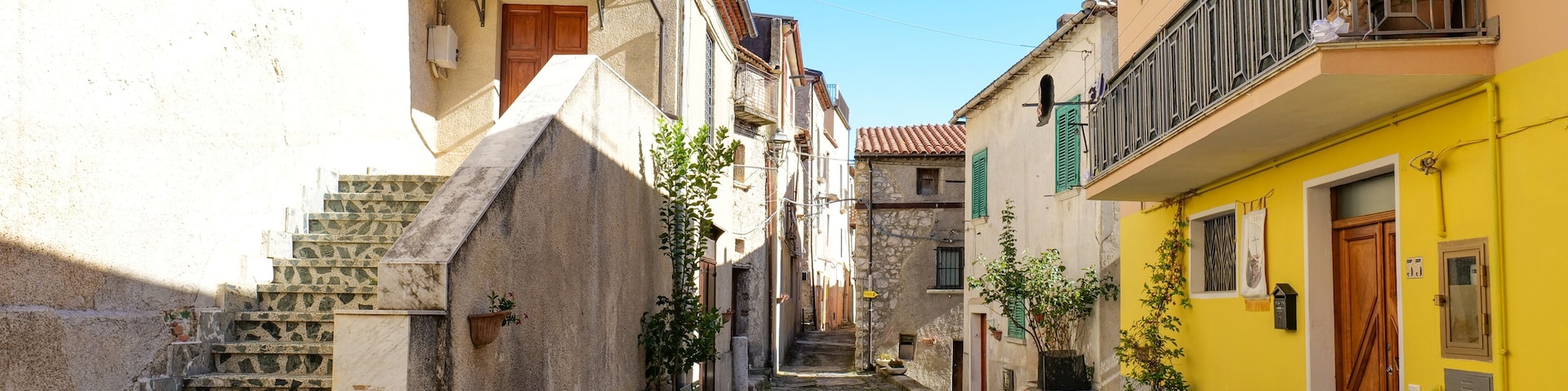 A narrow street among the old houses of Atena Lucana, a village in the province of Salerno, Italy.