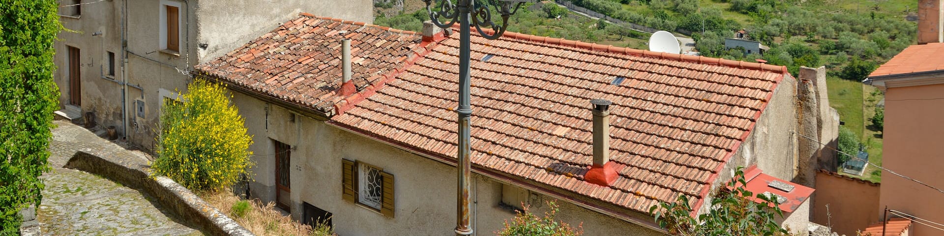 Province of Salerno, Italy, 05/27/2017. A narrow street among the old houses of a mountain village.