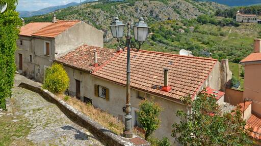 Province of Salerno, Italy, 05/27/2017. A narrow street among the old houses of a mountain village.