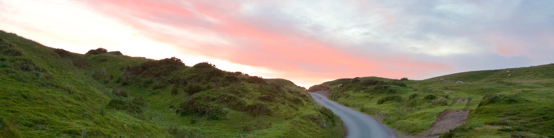 Brecon Beacons National Park showing farmland and a sunset