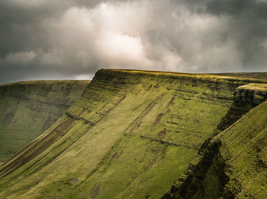 The Brecon Beacons (Welsh: Bannau Brycheiniog) is a mountain range in South Wales. In a narrow sense, the name refers to the range of Old Red Sandstone peaks which lie to the south of Brecon. Sometimes referred to as "the central Beacons" they include South Wales' highest mountain, Pen y Fan. The range forms the central section of the Brecon Beacons National Park