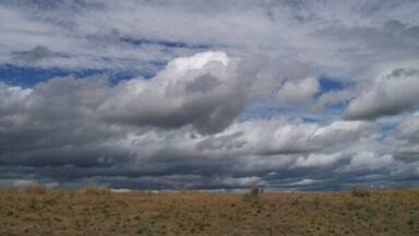 Earth meets sky. Took this while driving. Talk about a lucky shot!