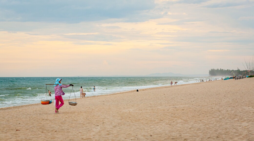 Mui Ne Beach showing a sandy beach and general coastal views as well as an individual femail