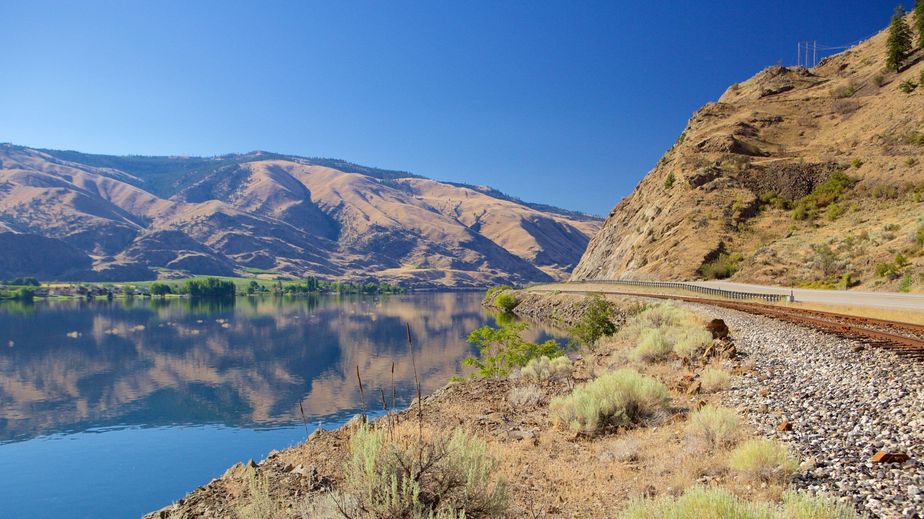 Wenatchee - Lake Chelan showing a lake or waterhole, mountains and railway items