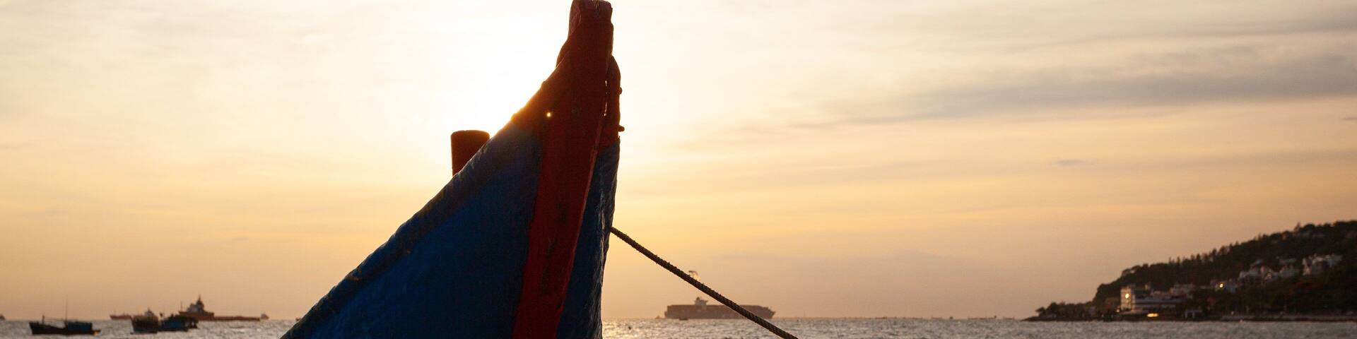 Vung Tau showing a beach, general coastal views and a sunset