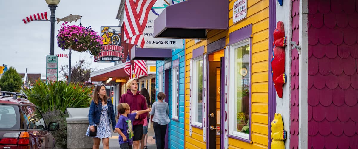 A colorful storefront with a sign reading "SHOPPE" and an American flag.