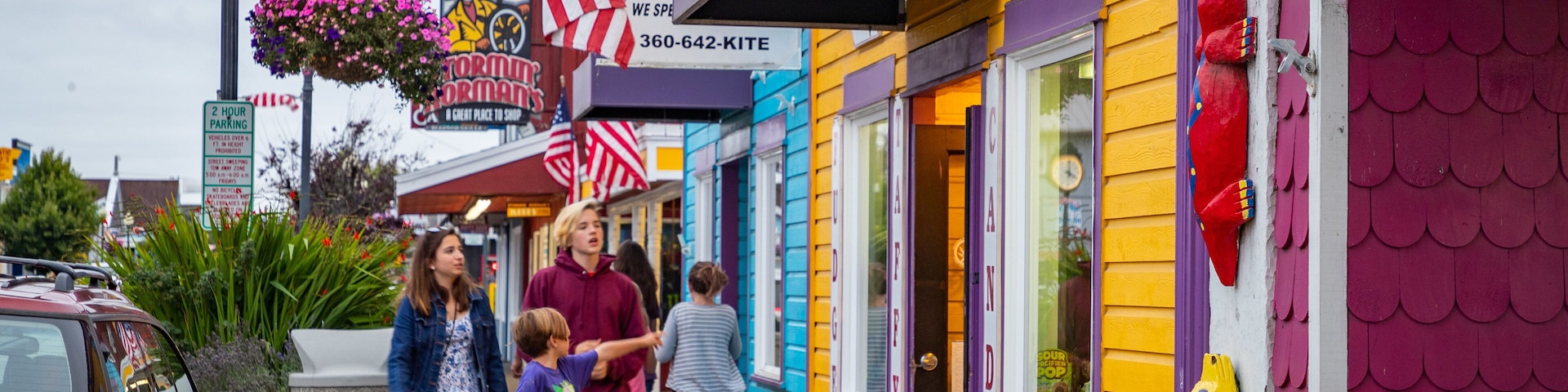 A colorful storefront with a sign reading "SHOPPE" and an American flag.