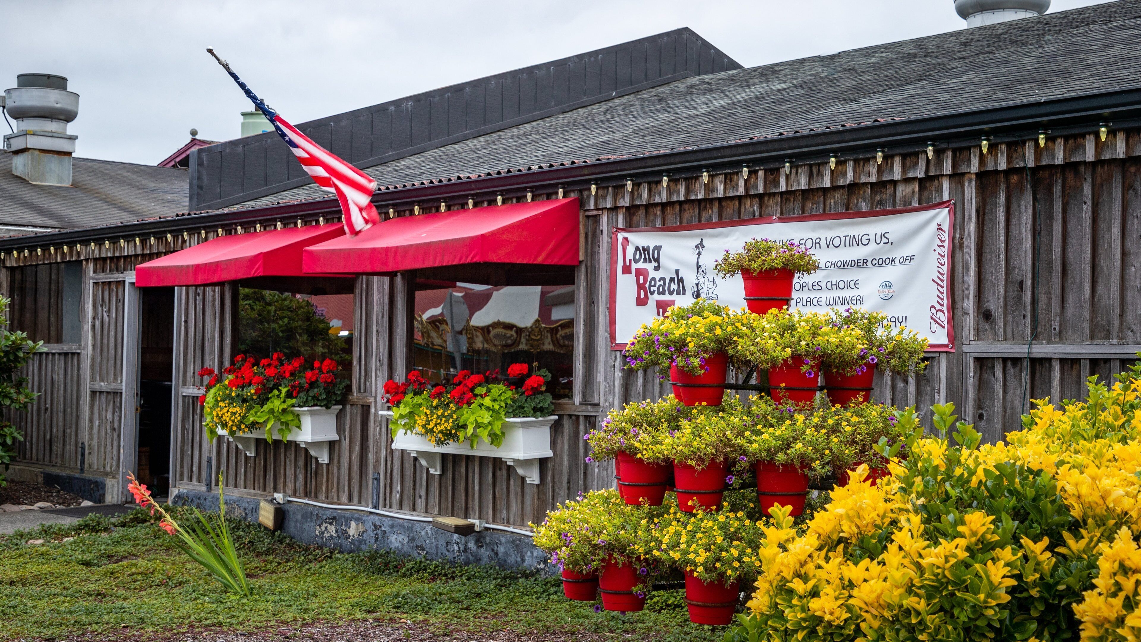 Long Beach which includes signage and flowers