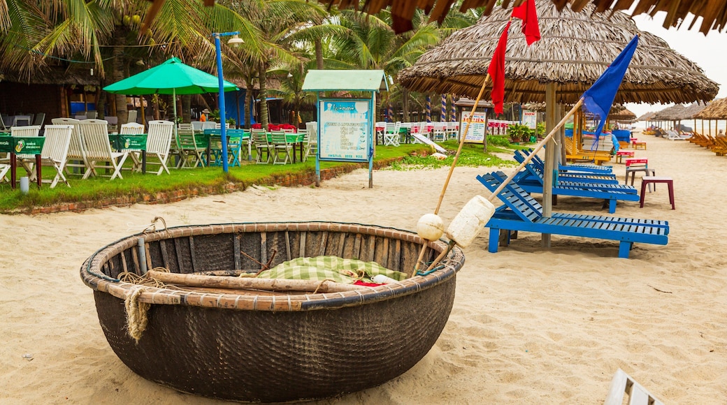 Cua Dai Beach which includes a beach and tropical scenes