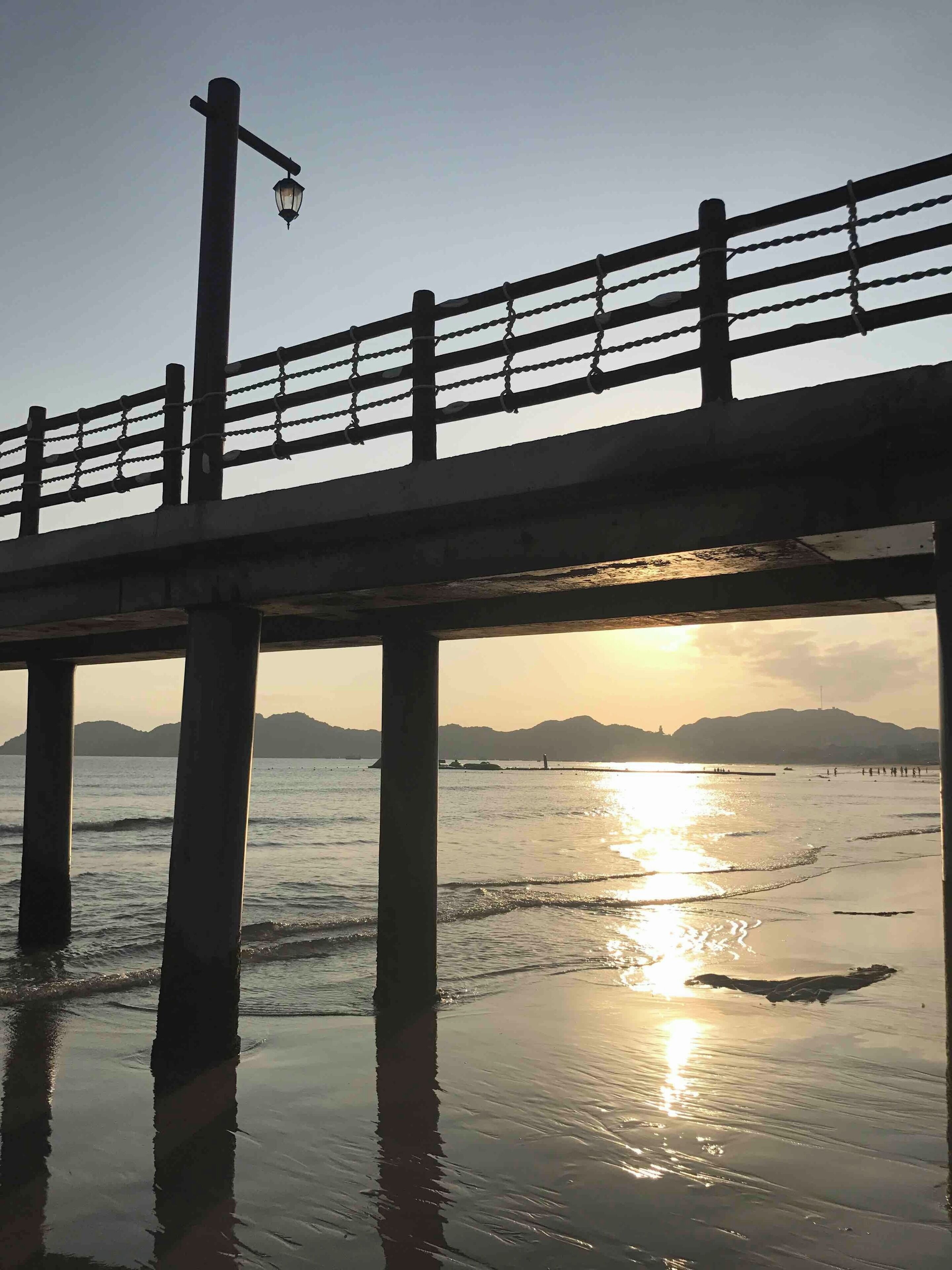 QUY NHON Vietnam
Take Domestic flight from Ho Chi Minh about an hour trip to Binh Dinh province.
FLC Hotel is just few meters from the shoreline of the Sea.
Bridge was built to add features to be enjoyed by Hotel guest.
Sunrise and Sunset here are beautiful especially when your 
walking bare footed on the beach