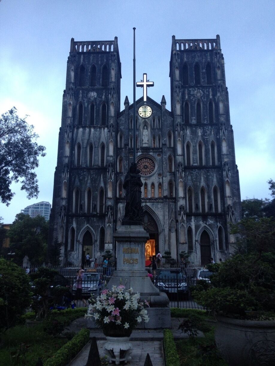 A Gothic-style cathedral with twin towers and a central clock.