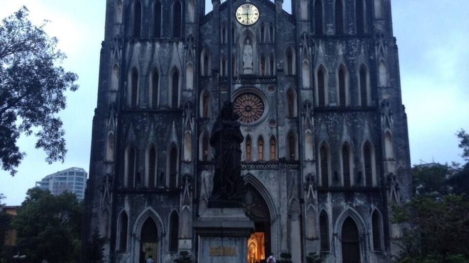 A Gothic-style cathedral with twin towers and a central clock.