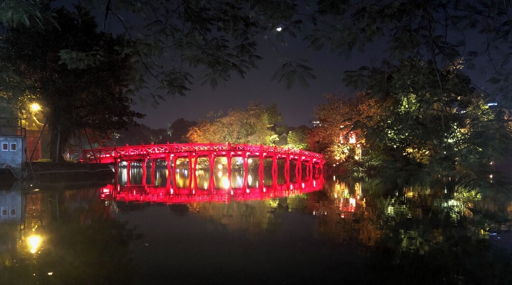 Nice reflection of the lighted up bridge with the moon behind