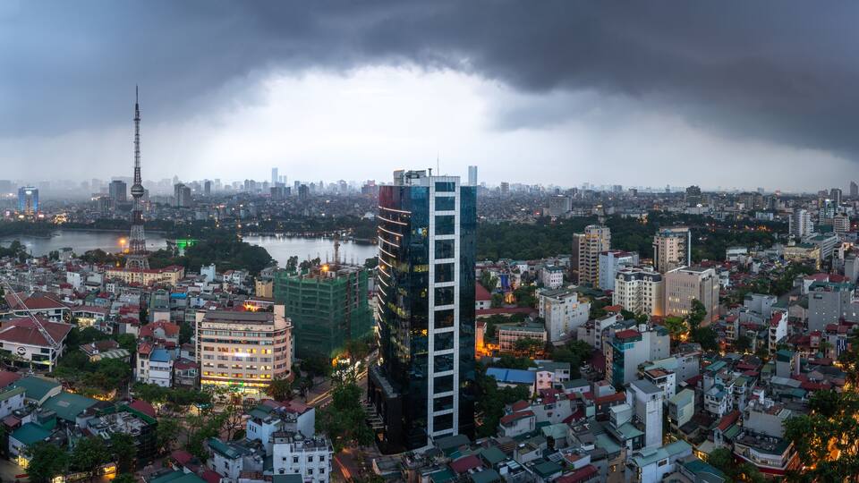 Aerial skyline view of Hanoi city, Vietnam. Hanoi cityscape by sunset period at Hai Ba Trung district viewing from Ba Trieu street