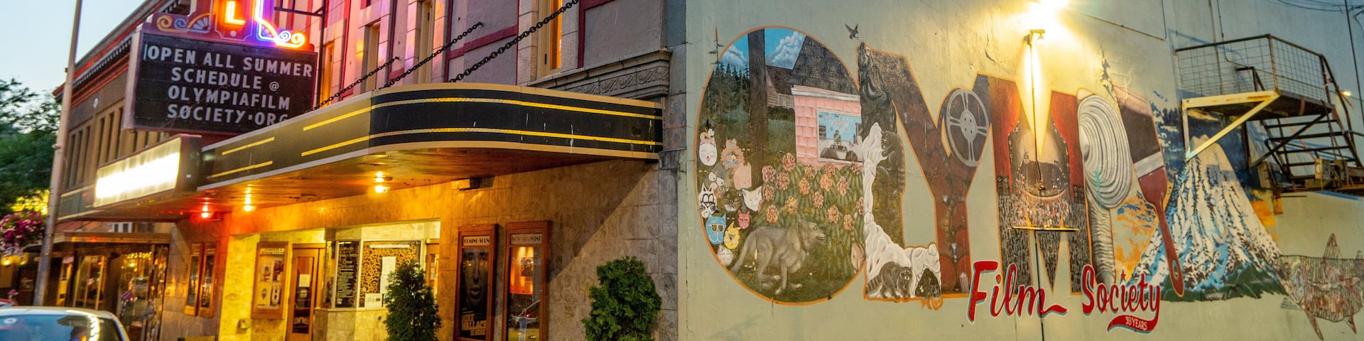 Olympia showing outdoor art and night scenes