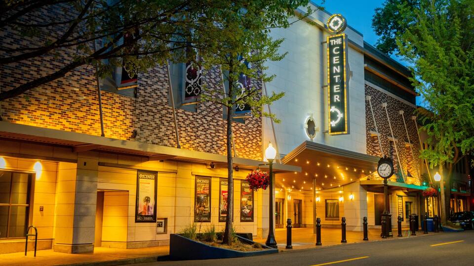 Olympia featuring night scenes and signage