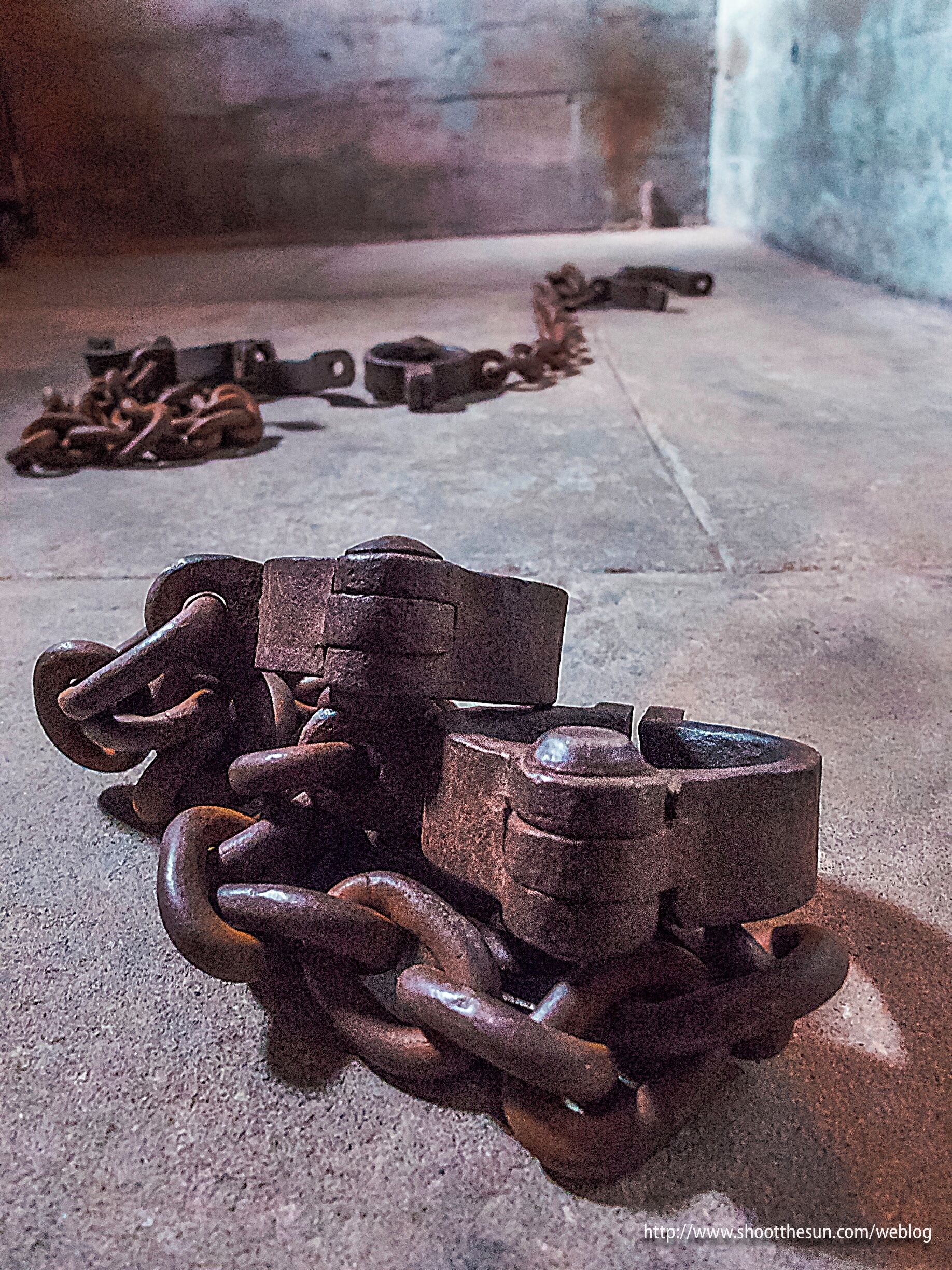 The building which houses the Historical Society, or as it's actually called: the Jefferson Museum of Art and History once contained the county courthouse and the city jail.

The courtroom remains intact, though it is now used to exhibit a continually-changing display of art.

The jail can be found in the basement, looking much as it must have for the hundred or so years of its operation.

The cells are there -- including one for solitary confinement; the glaring lights and concrete walls are all in place; and what would a worthwhile prison be without its cumbersome iron shackles?