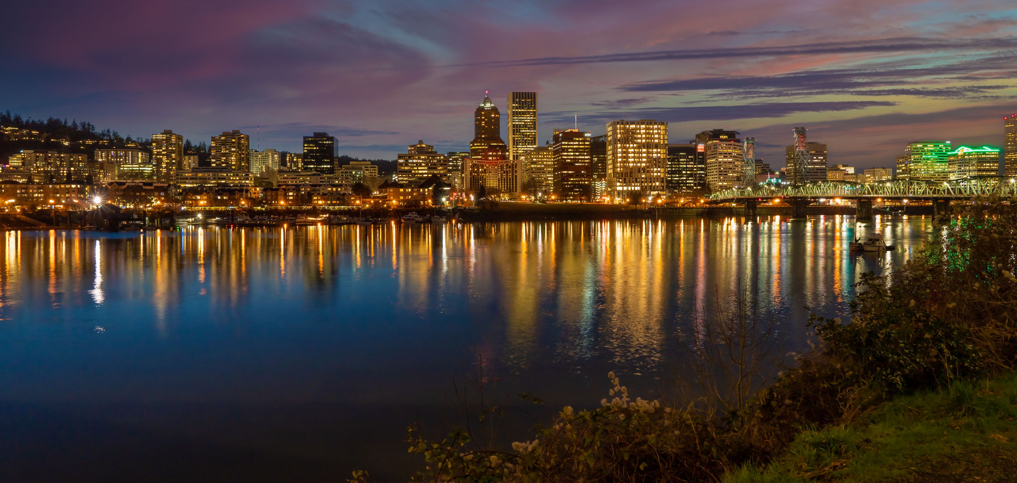 Looking west at the reflection of downtown Portland Oregon in the Willamette River at sunset