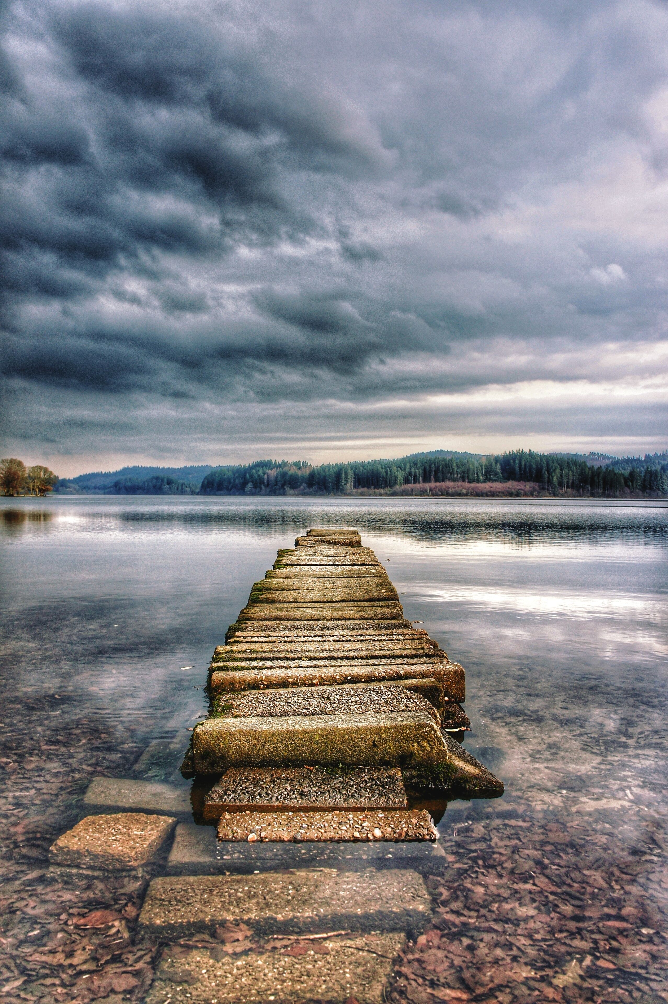 Rickety stone jetty overlooking Loch Ard