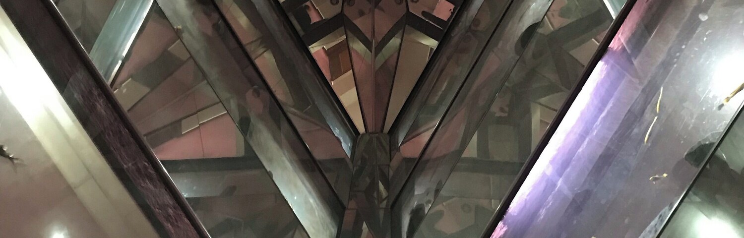 Fish tanks going all the way up several floors. The photo was taken from below looking up.