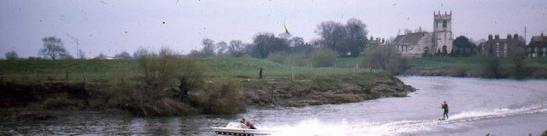 River Ouse at Cawood with Cawood Church Water ski-ing on the River Ouse used to be quite popular. This picture, from near the bridge, shows the bend of the river and Cawood Church in the background.