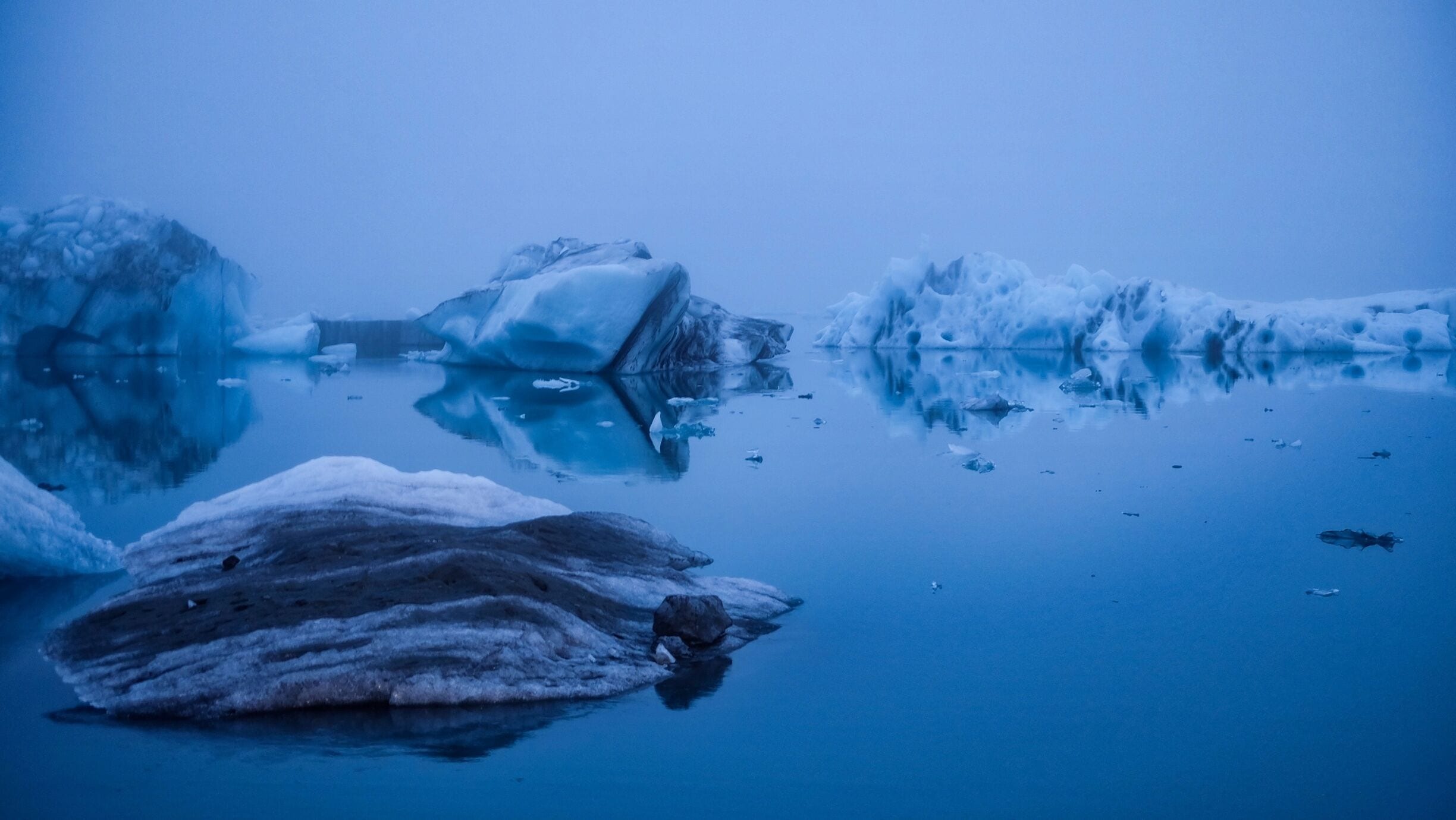 Arrived just minutes before midnight and it was still eerily bright; the summer midnight sun creating such a hauntingly surreal landscape by casting an atmospherically blue hue on the glacier and the surrounding lake.